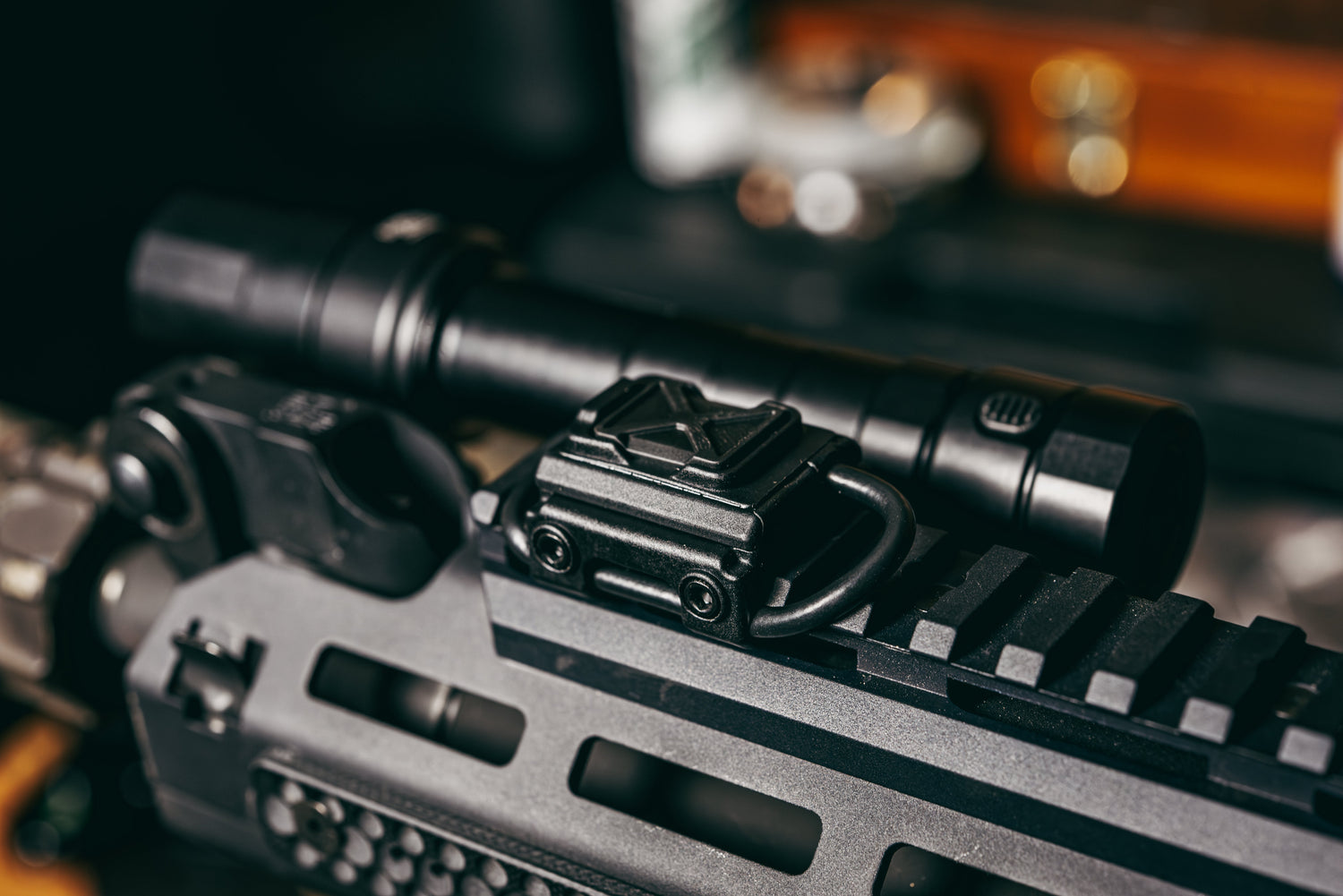 Close up of Cloud Defensive rifle light switch mounted on the top of a rifle.