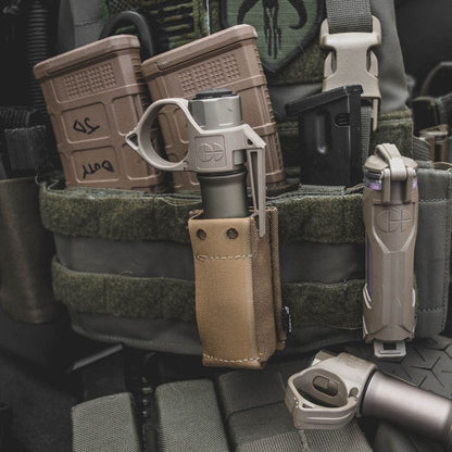 Flashlight with FDE ring in a pouch mounted to a plate carrier