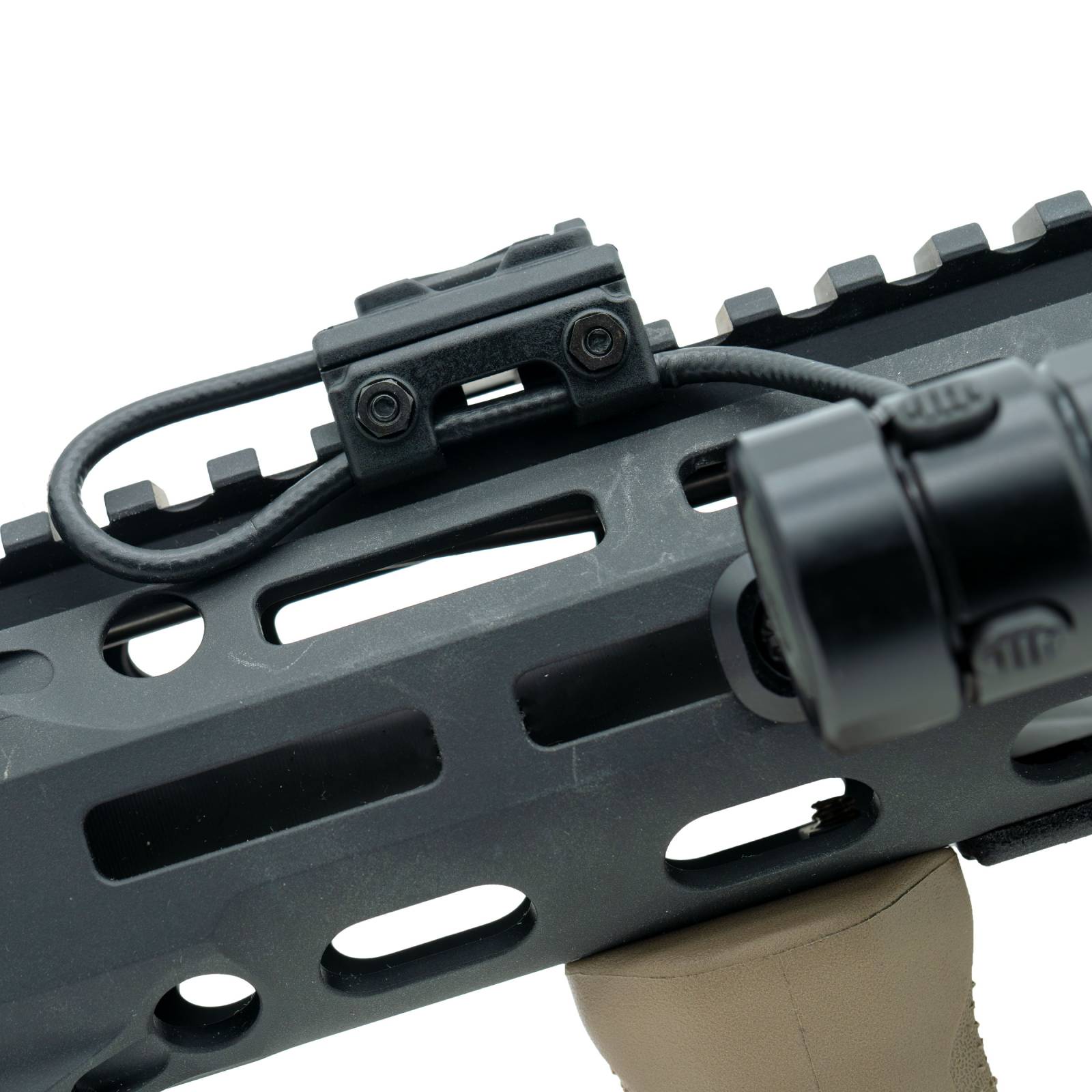 Close up of Rein single button constant on switch mounted to a handguard. Side view.