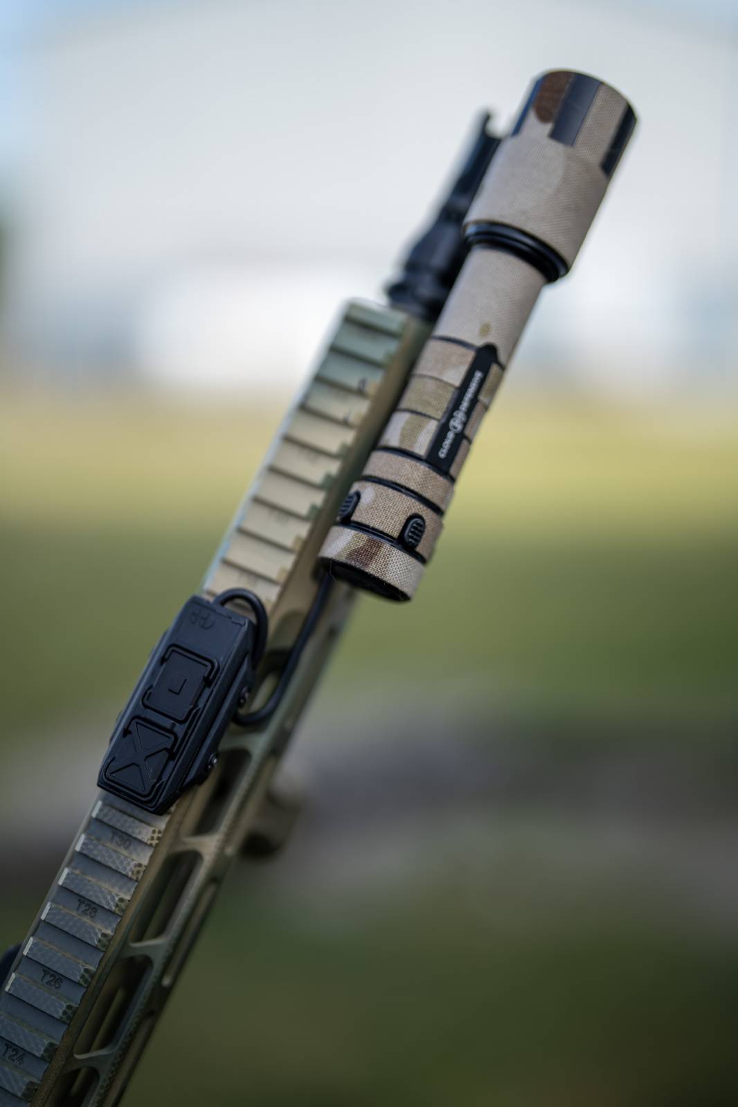 Top view of Rein dual button switch mounted to a rifle with Rein flashlight.